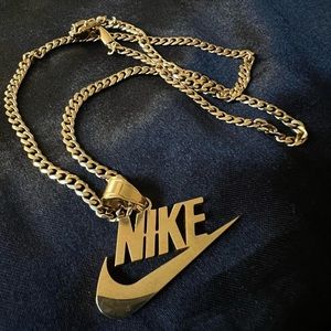 Gold Nike Pendant & Chain